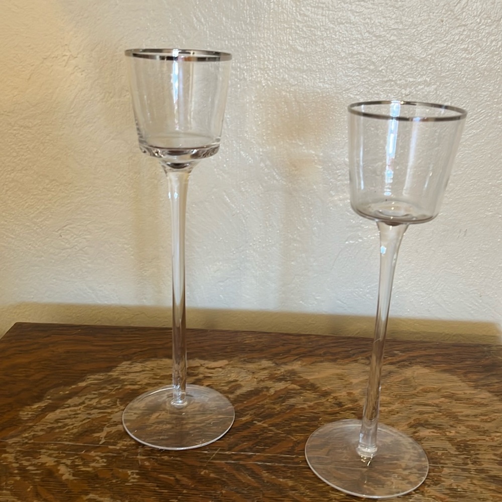 Set of two tall glass votive candle holders, different sizes